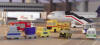 herpa - Airport Accessories Set I - HE560948 - Gangway, passenger stairs large and small, bus, tank truck, fire engine, catering vehicle, police van, follow me bus, tractor with luggage vehicles.
