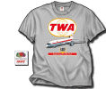TWA L-1011 TriStar T-Shirt - The TWA L-1011 served the airline for many years in long-haul domestic USA service before being retired from the fleet. Here we have it in the original colors on the front of a 100% ash shirt. Sizes M, L, XL, XXL, and 3XL
