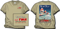 TWA Constellation Tails T-Shirt - Just out of the box! Our brand new TWA Connie Tails shirt! Taken from an old TWA poster, it has the reproduction of the poster on the back and the small TWA logo "Fly the Finest" on the front. On a Gildan Tan shirt! Sizes M, L, XL, and XXL